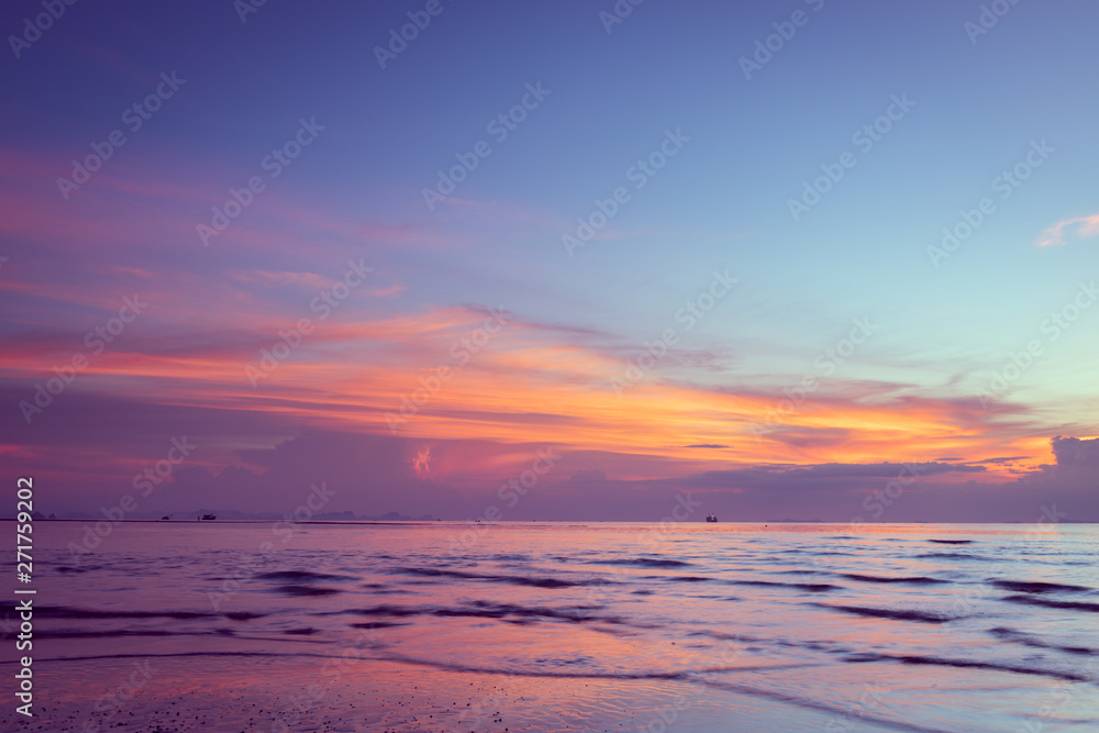 Beautiful tropical pink blue sea  sunset and yellow clouds baclground