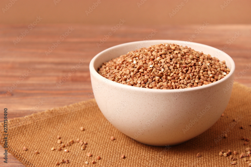 raw buckwheat on a colored background. raw buckwheat on a colored background.
