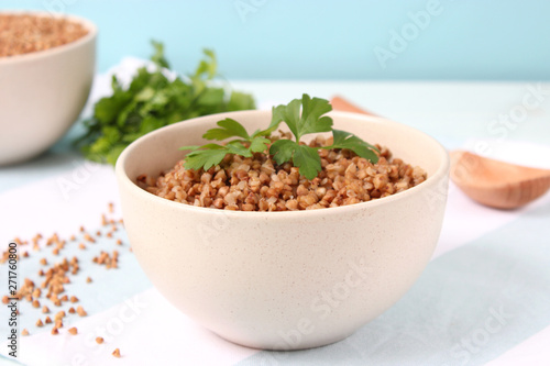 boiled buckwheat in a plate on the table.
