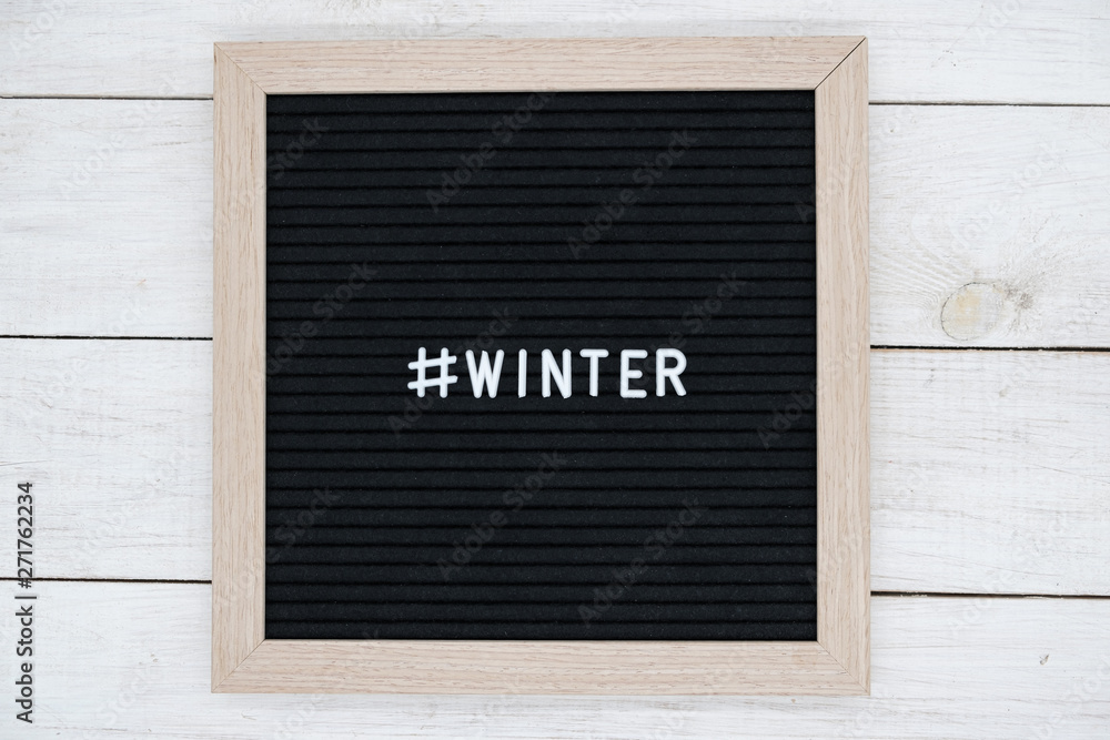 black felt Board with hashtag and word winter in English