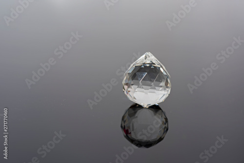 Abstract photo with small glass balls on transparent background.