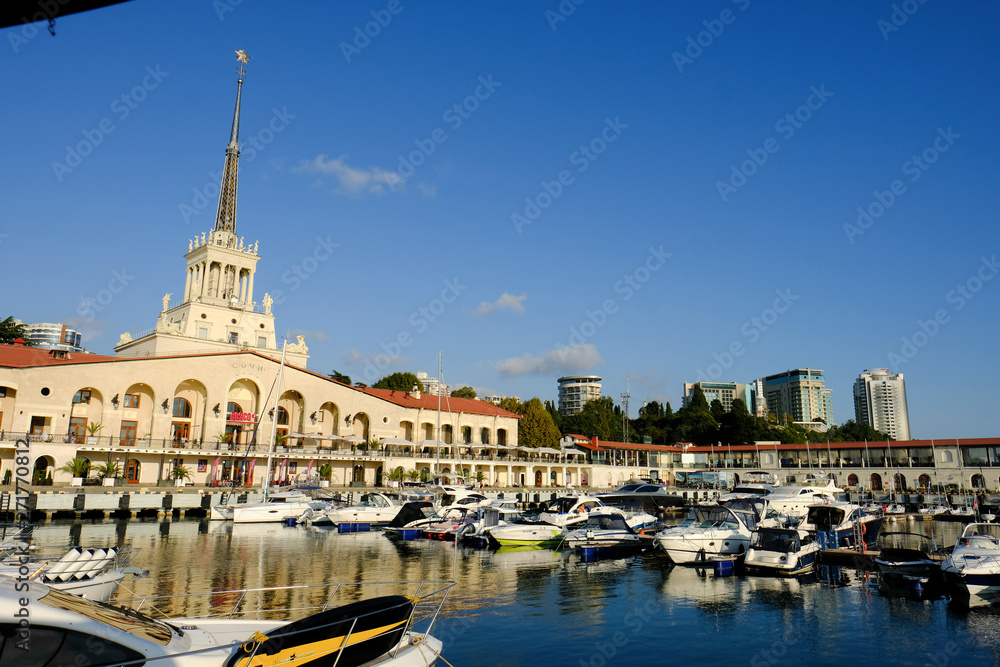 Obraz premium Commercial seaport of Sochi, Russia. Yachts and ships on Black Sea.