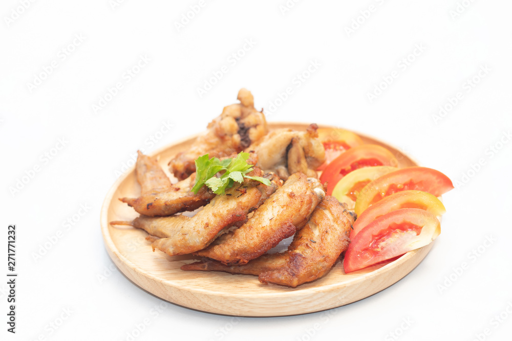 Fried chicken wings to serve to customers in the restaurant on white isolated background. Good quality products that are fresh and safe. Online food order concept. Fried chicken wings to serve to customers in the restaurant on white isolated background. Good quality products that are fresh and safe. Online food order concept.
