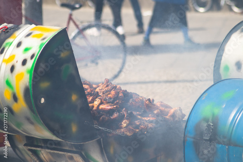 Caribbean jerk chicken being barbecued and sold as street food. photo