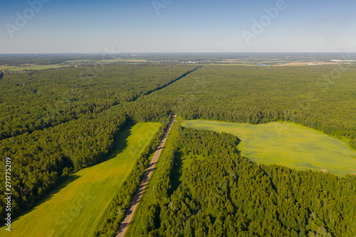 Aerial view of summer green rural road in Moscow area, Russia