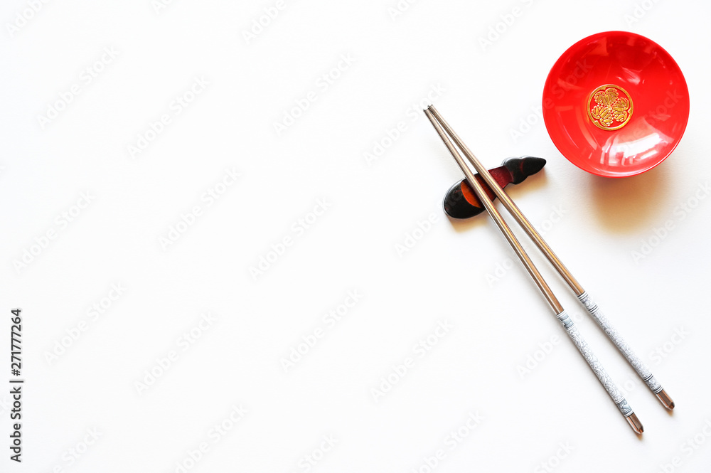 Chopsticks and Red bowl for sushi on White background Copy space Chopsticks and Red bowl for sushi on White background Copy space