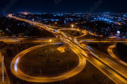 interchange freeway high way motorway and ring road transportation logistics connect in the city with lighting the city background