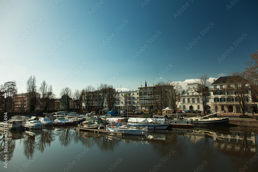 Fototapeta premium Alsace, Mulhouse, canal with boats, cityscape