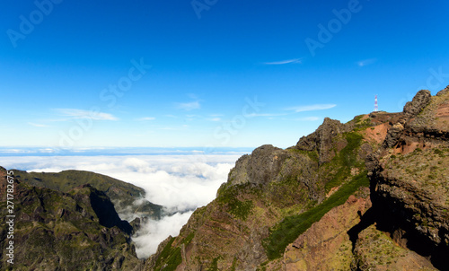 Wide angle shot of Mountain peaks against blue sky with white clouds on a beautiful summer day. Near Pico de Areeiro (Arieiro), Central Madeira, Portugal, Europ photo