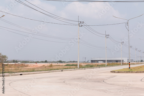 Empty cement road and under developing land in industrial park