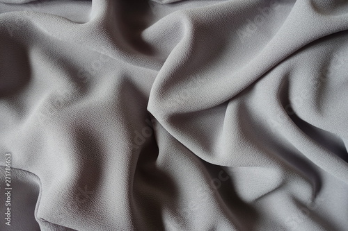 Folded grey crepe georgette fabric from above