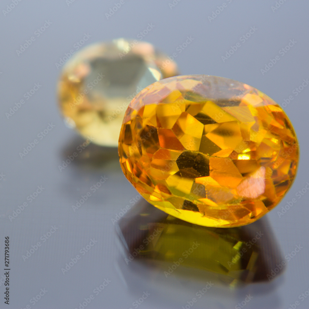 Natural yellow Sapphire gemstone, beautiful yellow gold citrin gemstone isolated on white background, as jewelry background Natural yellow Sapphire gemstone, beautiful yellow gold citrin gemstone isolated on white background, as jewelry background