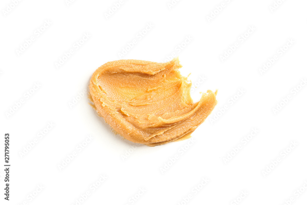 Creamy peanut butter isolated on white background. A traditional product of American cuisine