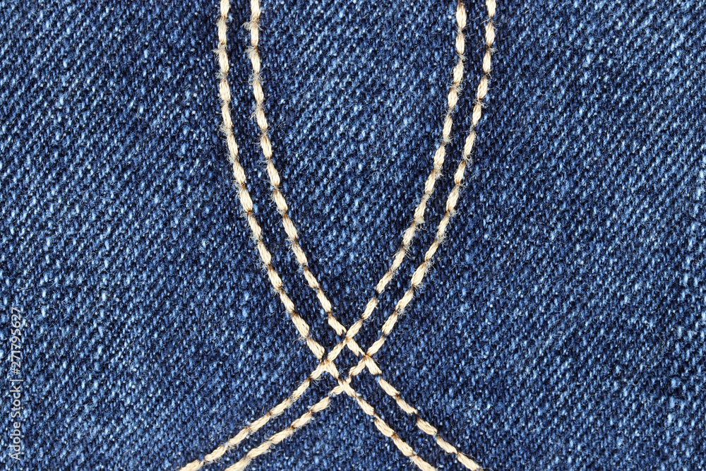 Embroidered buttonhole on jeans, texture Embroidered buttonhole on jeans, texture