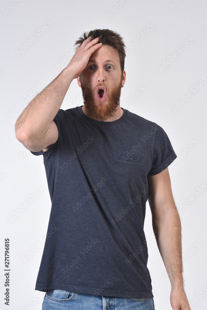 man with expression of forgetfulness or surprise on white background man with expression of forgetfulness or surprise on white background