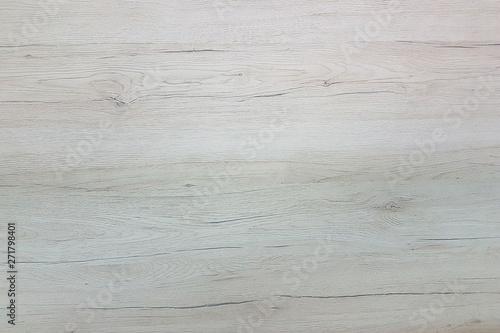The texture of the polished cut of a tree in gray tones. The cut of the board of the sawn wood. Natural construction material. Furniture manufacture. Decoration and design of premises. Interior finis