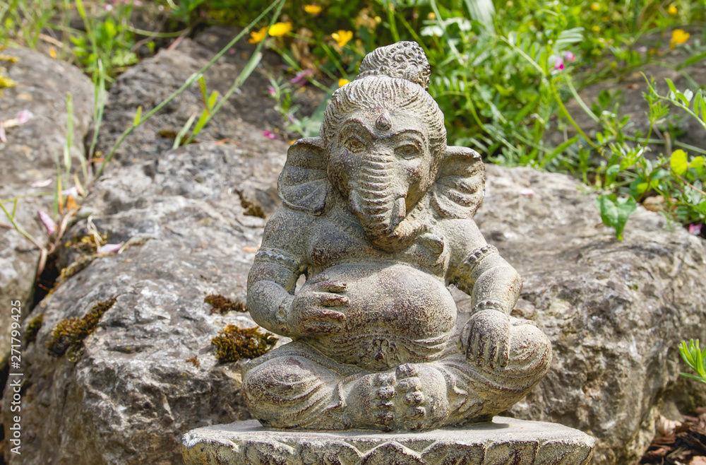 Fototapeta premium Ganesh deity with elephant head stone statue