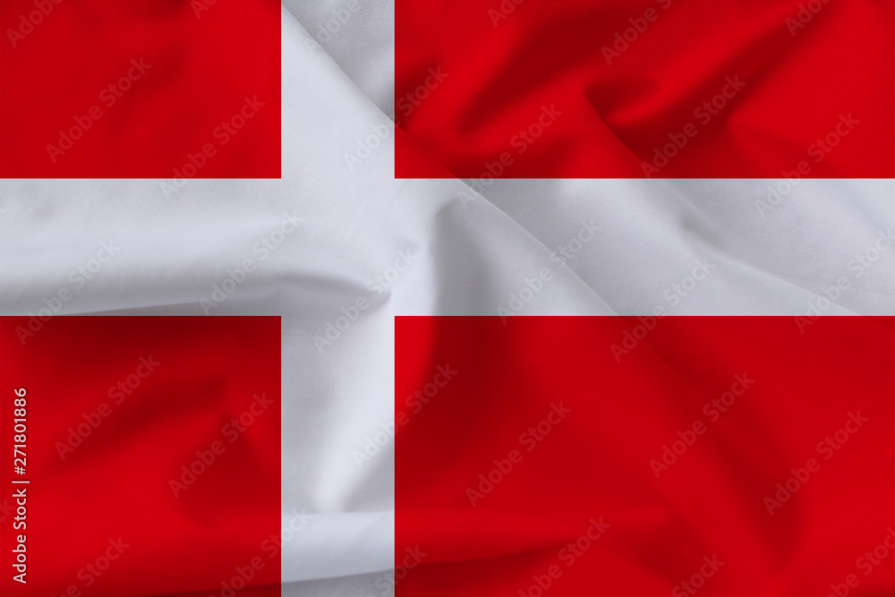Beautiful silk flag of Denmark with soft folds in the wind Beautiful silk flag of Denmark with soft folds in the wind