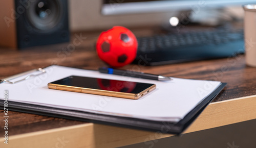 Wallpaper Mural Clipboard with notes and a mobile phone on a desk Torontodigital.ca