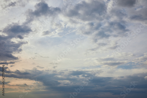 Photography blue clouds on grey sky background and sun rays