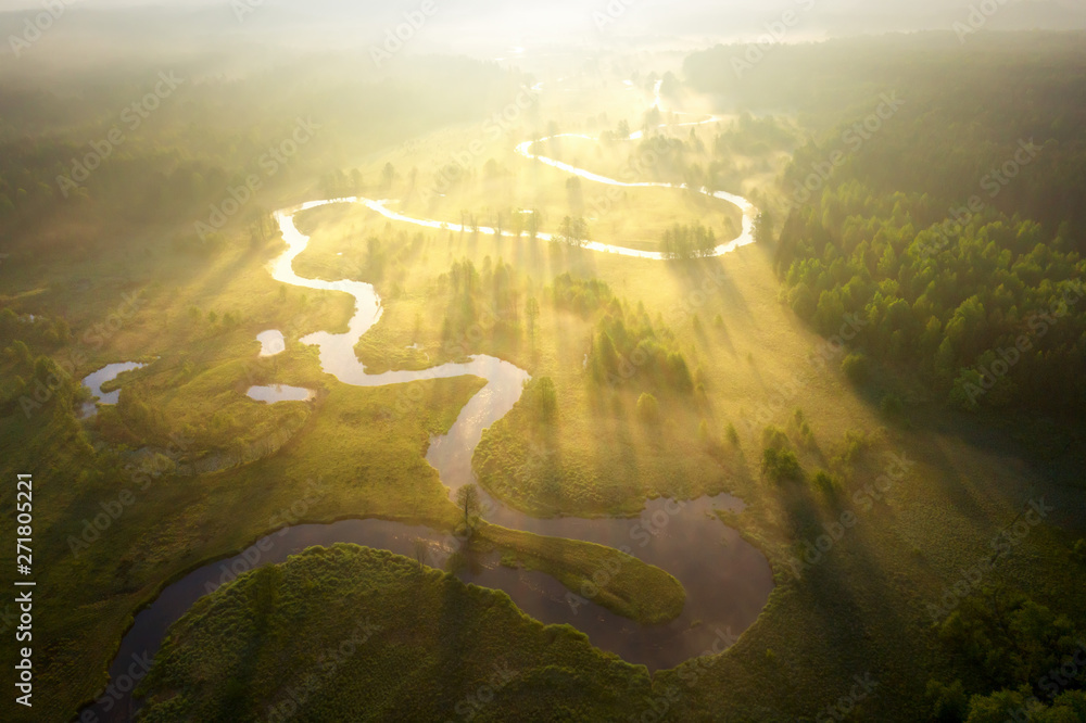 Misty morning river in sunlight. River landscape aerial view. Riverside view from above. Summer nature in sun rays. Drone view on  sunny nature. Scenery river top view. - obrazy, fototapety, plakaty 