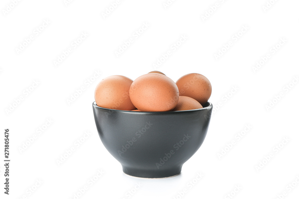 Brown chicken eggs in bowl isolated on white background Brown chicken eggs in bowl isolated on white background