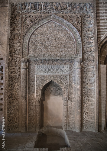 Ornate arabic calligraphy on the Oljeitu mihrab at the Jameh masjid or Friday mosque, Isfahan Province, Isfahan, Iran photo