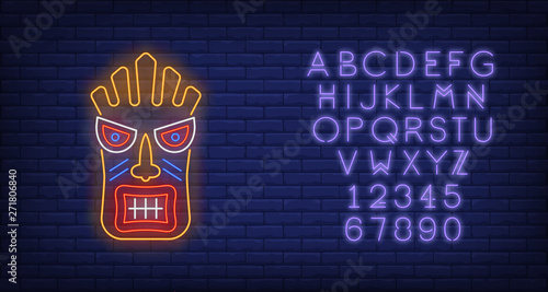 Bright tiki idol neon sign. Tribal mask, ancient culture design. Night bright neon sign, colorful billboard, light banner. Vector illustration in neon style.