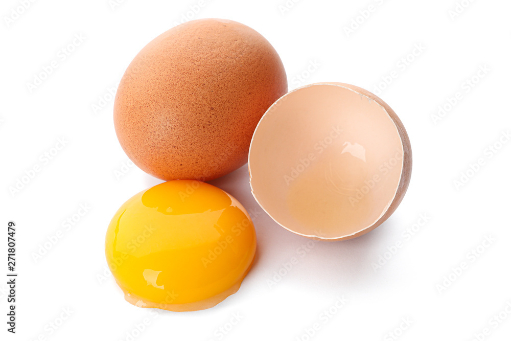 Whole egg, half eggshell and egg yolk isolated on white background Whole egg, half eggshell and egg yolk isolated on white background