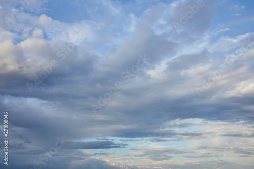 grey clouds on blue sunlight sky background