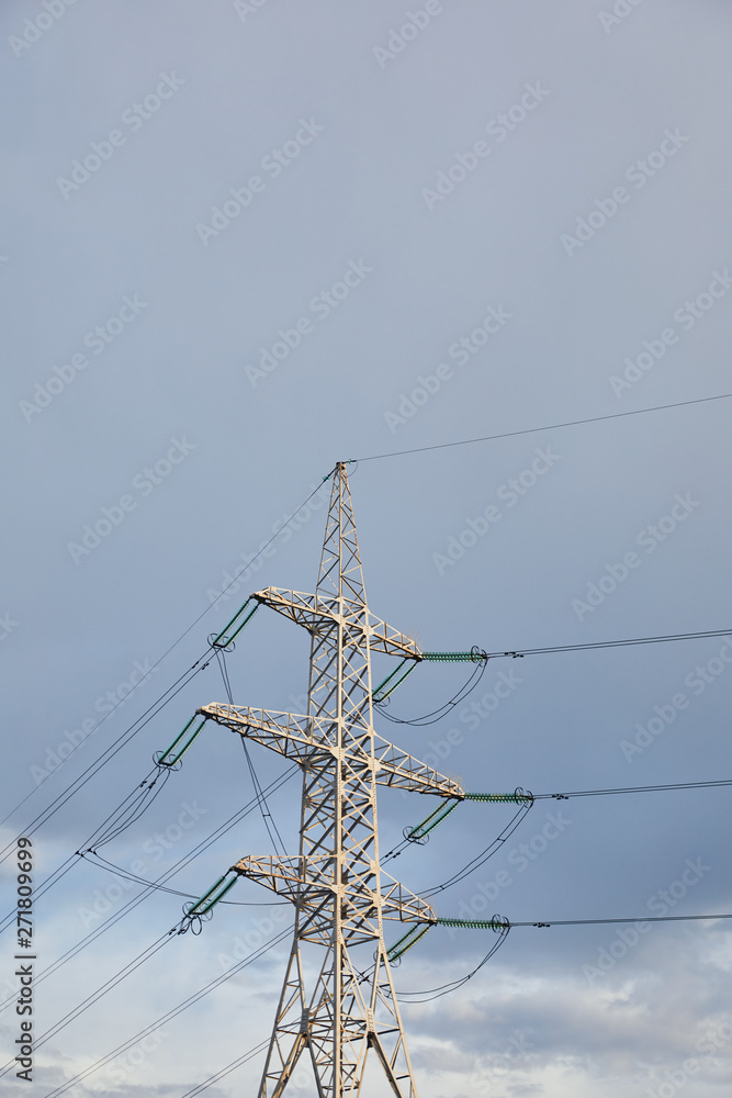 low angle view of electric pole with wires on grey cloudy background low angle view of electric pole with wires on grey cloudy background