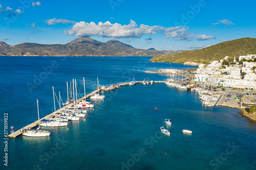 aerial view to volcanic greek island with yacht harbor in sunny day