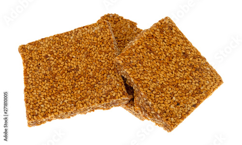 Pieces of sesame seed crunch on a white background photo