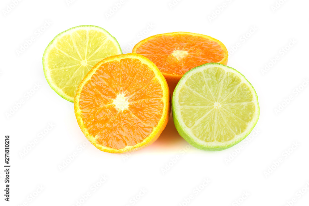 Fruit assortment of tangerine and lime with leaves Fruit assortment of tangerine and lime with leaves