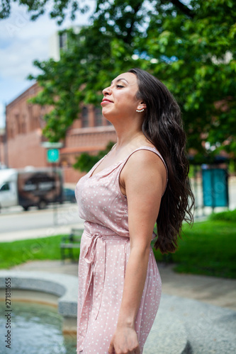 beautiful young Hispanic is having fun and smiling in a outdoor park in Chicago wearing a sexy pink summer dress. Latin model enjoys her stay downtown near this pretty landmark Free Download beautiful young Hispanic is having fun and smiling in a outdoor park in Chicago wearing a sexy pink summer dress. Latin model enjoys her stay downtown near this pretty landmark - GFXLoad