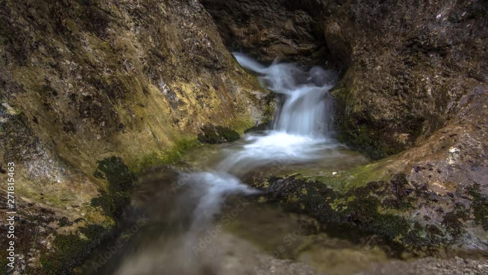 Mountain stream waterfall between rocks deep in the forest 4k time lapse Mountain stream waterfall between rocks deep in the forest 4k time lapse