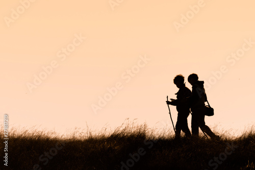 silhouette of family in sunset