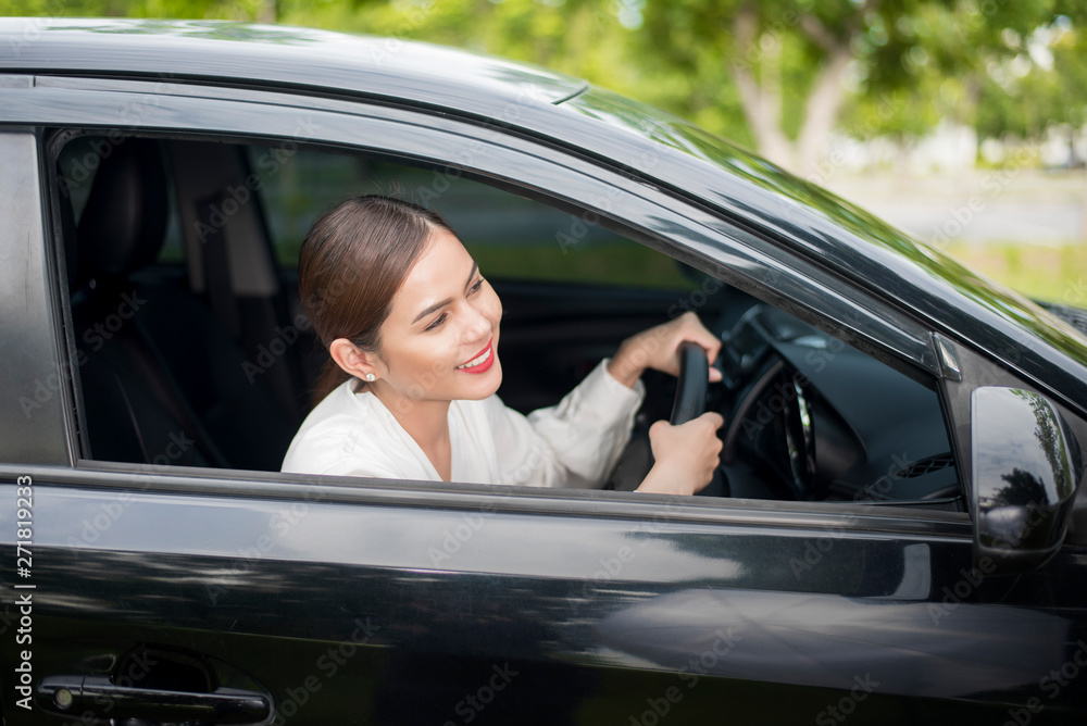 Beautiful woman is driving her car