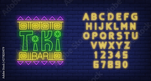 Tiki bar neon text with ethnic ornament. Resort, party, vacation design. Night bright neon sign, colorful billboard, light banner. Vector illustration in neon style.