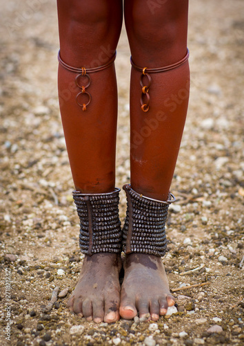 Himba Woman With Beaded Anklets To Protect Their Legs From Venomous Animal Bites, Epupa, Namibia photo