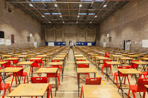 Exam tables set up in a sports hall for exams in a high school & sixth form