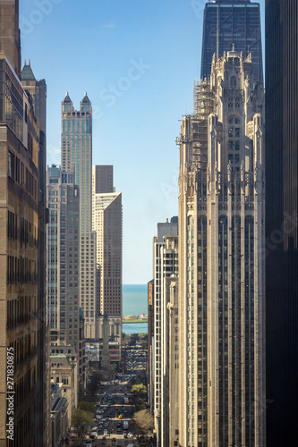 Chicago skyscrapers line the fabulous Michigan Ave, "Magnificent Mile". View of Michigan Ave and Lake Michigan seen from high-rise building. © CAG Photography