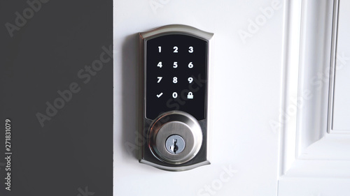 Obraz na plátne Digital smart door lock security system with the password, close up on numbers on the screen