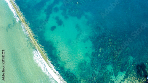 Fototapeta Naklejka Na Ścianę i Meble -  aerial view of path crossing the sea