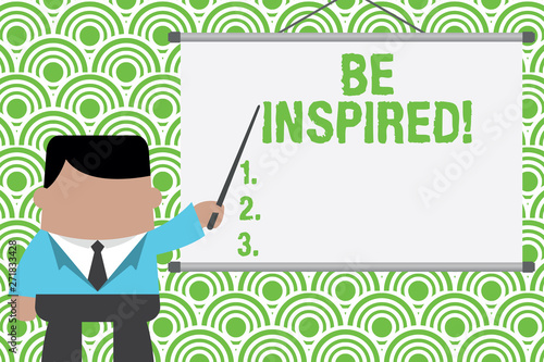 Text sign showing Be Inspired. Business photo text fill someone with urge or ability to do or feel something Businessman standing in front projector screen pointing project idea © Artur