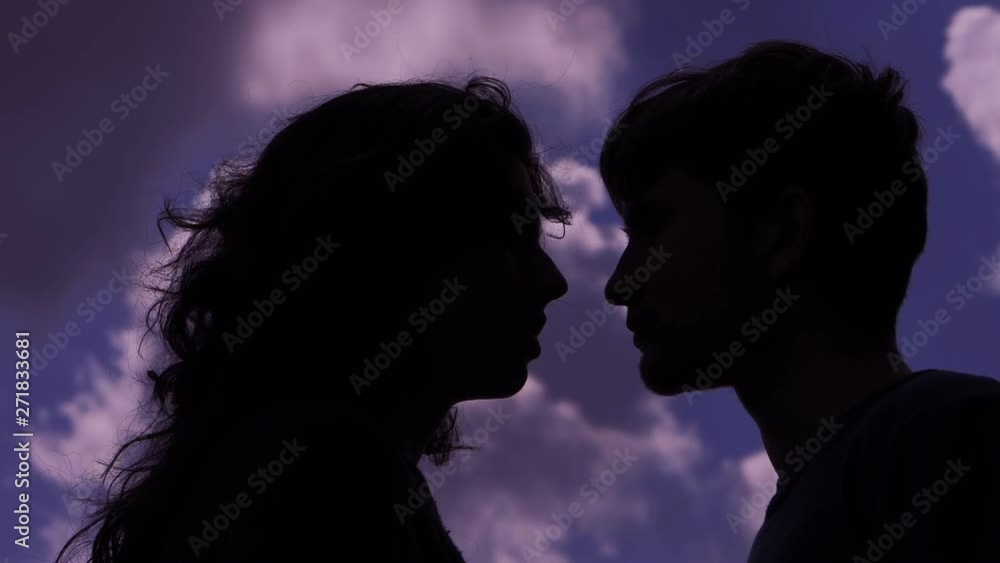 Love,Romance,kiss. Young couple flirting ,kissing at sunset Love,Romance,kiss. Young couple flirting ,kissing at sunset