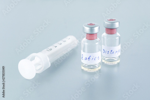 medicine bottle with rabies vaccine and distemper for animal health