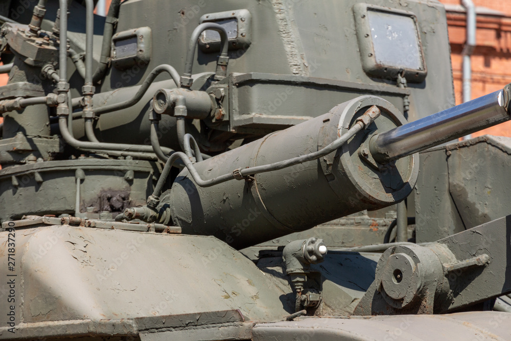 metal parts of the body of military equipment close-up. Armored war machine. Steampunk Background. Soviet military tracked rubble clearing machine