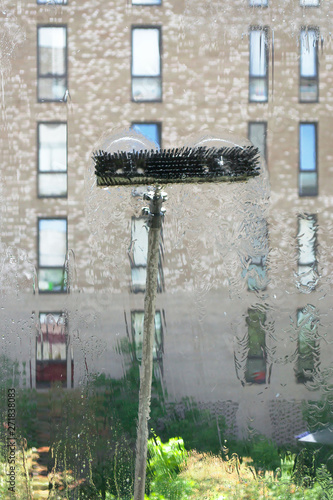 Window glass cleaning with pure water and extension pole. Washing and rinse using a reach and wash system.