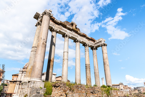 Temple of Saturn - ruins with old historical columns. Roman Forum archeological site, Rome, Italy photo